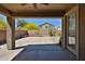Covered patio with a view of the landscaped backyard featuring a desert landscape at 14214 W Ventura St, Surprise, AZ 85379