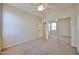 This bedroom features carpet flooring, a ceiling fan and a large closet with mirrored doors at 14214 W Ventura St, Surprise, AZ 85379
