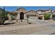 Charming single-story home with a desert-landscaped front yard and two car garage at 14214 W Ventura St, Surprise, AZ 85379