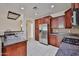 Modern kitchen featuring stainless steel appliances and dark wood cabinetry at 14214 W Ventura St, Surprise, AZ 85379
