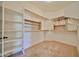Walk-in closet with shelving and racks for optimal organization at 14214 W Ventura St, Surprise, AZ 85379