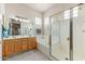 Bright bathroom featuring double sinks, bathtub, and glass-enclosed shower at 15201 N Zapata Dr, Fountain Hills, AZ 85268