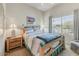 Cozy bedroom with a comfortable bed, bedside tables, and a view of the outdoors at 15201 N Zapata Dr, Fountain Hills, AZ 85268