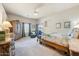Serene bedroom with a bed, dresser, ceiling fan and large windows at 15201 N Zapata Dr, Fountain Hills, AZ 85268