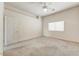 Spacious bedroom with neutral walls, ceiling fan, and carpet flooring at 15201 N Zapata Dr, Fountain Hills, AZ 85268