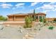 Charming desert home with a three car garage, tile roof, and desert landscaping at 15201 N Zapata Dr, Fountain Hills, AZ 85268