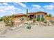 Beautiful home with desert landscaping, mature trees, and a large garage at 15201 N Zapata Dr, Fountain Hills, AZ 85268