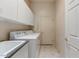 Convenient laundry room with a sink, washer, dryer, and ample cabinet space at 15201 N Zapata Dr, Fountain Hills, AZ 85268