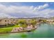 Stunning aerial view of lakeside homes, showcasing the community's serene setting and lush landscaping at 16013 S Desert Foothills Pkwy # 2055, Phoenix, AZ 85048
