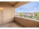 Exterior view from a condo balcony overlooking the complex and parking area at 16013 S Desert Foothills Pkwy # 2055, Phoenix, AZ 85048