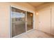 View from balcony showing sliding glass door and a utility door at 16013 S Desert Foothills Pkwy # 2055, Phoenix, AZ 85048