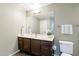 Bright bathroom features a vanity with double sinks and a decorative flower at 16013 S Desert Foothills Pkwy # 2055, Phoenix, AZ 85048