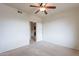 This bedroom offers a ceiling fan and an open door to another room at 16013 S Desert Foothills Pkwy # 2055, Phoenix, AZ 85048
