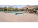 Community pool and hot tub with comfortable lounge chairs and desert landscape at 16013 S Desert Foothills Pkwy # 2055, Phoenix, AZ 85048
