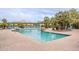 Community pool featuring lush palm trees, comfortable lounge chairs and pergolas at 16013 S Desert Foothills Pkwy # 2055, Phoenix, AZ 85048