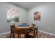 A game room with a poker table and a view of the outdoor area through a window at 16013 S Desert Foothills Pkwy # 2055, Phoenix, AZ 85048