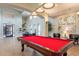 Spacious game room featuring a red billiard table, high ceilings, and tasteful decor for a relaxing atmosphere at 16013 S Desert Foothills Pkwy # 2055, Phoenix, AZ 85048