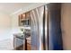Updated kitchen with stainless steel refrigerator, oven, microwave, and modern cabinets providing efficiency and style at 16013 S Desert Foothills Pkwy # 2055, Phoenix, AZ 85048