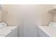Bright laundry area with washer and dryer, plus wire shelving for storage at 16013 S Desert Foothills Pkwy # 2055, Phoenix, AZ 85048