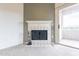 Cozy living room features a tile fireplace and access to a private balcony at 16013 S Desert Foothills Pkwy # 2055, Phoenix, AZ 85048