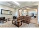 Comfortable living room with a brown leather couch, coffee table, and stylish decor for a relaxing atmosphere at 16013 S Desert Foothills Pkwy # 2055, Phoenix, AZ 85048