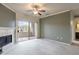 Spacious living room featuring a fireplace, balcony access, and ample natural light, creating a welcoming environment at 16013 S Desert Foothills Pkwy # 2055, Phoenix, AZ 85048