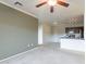 Bright living room features neutral walls, carpeting, and an open-concept kitchen, creating a comfortable and inviting atmosphere at 16013 S Desert Foothills Pkwy # 2055, Phoenix, AZ 85048