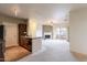 Open living space with a kitchen island, stainless appliances, and a seamless flow into the living and dining areas at 16013 S Desert Foothills Pkwy # 2055, Phoenix, AZ 85048