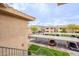 Parking area with covered spaces, community buildings and mountain views in the background at 16013 S Desert Foothills Pkwy # 2055, Phoenix, AZ 85048