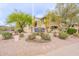 San Simeon Condominiums sign with mature desert landscaping and flowering trees at 16013 S Desert Foothills Pkwy # 2055, Phoenix, AZ 85048