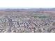 Stunning aerial view of a residential area with nearby downtown shops and retail, and mountain views in Fountain Hills, AZ at 16616 E Gunsight Dr # 114, Fountain Hills, AZ 85268