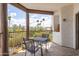Serene balcony with seating area providing scenic views of lush landscaping and swaying palm trees at 16616 E Gunsight Dr # 114, Fountain Hills, AZ 85268