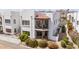 Well-maintained building exterior with patios surrounded by desert landscaping, enhancing curb appeal at 16616 E Gunsight Dr # 114, Fountain Hills, AZ 85268