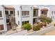 Charming building exterior featuring Spanish-style architecture, stairwell, and well-maintained landscaping at 16616 E Gunsight Dr # 114, Fountain Hills, AZ 85268