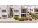 Condo complex featuring red tile roofs, stucco walls, patios, and desert landscaping against a mountain backdrop at 16616 E Gunsight Dr # 114, Fountain Hills, AZ 85268