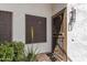 Inviting front porch with a secure, decorative security door and desert landscaping at 16616 E Gunsight Dr # 114, Fountain Hills, AZ 85268