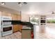 Open kitchen with granite countertops and a view into the living area at 16616 E Gunsight Dr # 114, Fountain Hills, AZ 85268