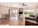 Open concept living area featuring tile flooring, a chandelier, built-in shelving, and balcony access at 16616 E Gunsight Dr # 114, Fountain Hills, AZ 85268
