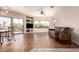 Spacious living room featuring tile floors, a ceiling fan, and sliding glass doors to a balcony at 16616 E Gunsight Dr # 114, Fountain Hills, AZ 85268