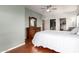 Bedroom with hardwood floors, dresser, en suite, and walk-in closet at 16616 E Gunsight Dr # 114, Fountain Hills, AZ 85268