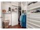 Organized walk-in closet with shelving, drawers, and hanging rods at 16616 E Gunsight Dr # 114, Fountain Hills, AZ 85268