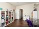 Bright room featuring wood floors, white shelving and desk with natural light at 16876 W Stevenage St, Surprise, AZ 85374
