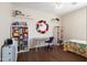 Stylized bedroom with modern furnishings and hardwood floors at 16876 W Stevenage St, Surprise, AZ 85374
