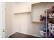 Walk-in closet with wood floors and wood shelving for optimal storage solutions at 16876 W Stevenage St, Surprise, AZ 85374