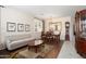 Elegant dining room area with wood floors, sophisticated furniture, and plenty of natural light at 16876 W Stevenage St, Surprise, AZ 85374