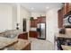 Bright kitchen with granite countertops, stainless steel appliances, and ample cabinet space at 16876 W Stevenage St, Surprise, AZ 85374