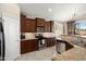 Well-equipped kitchen featuring granite countertops and stainless steel appliances at 16876 W Stevenage St, Surprise, AZ 85374