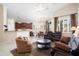 Open-concept living area with modern kitchen, dining space, and comfortable living room seating at 16876 W Stevenage St, Surprise, AZ 85374