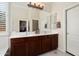 Main bathroom featuring double sink vanity and ample lighting at 16876 W Stevenage St, Surprise, AZ 85374