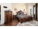 Inviting main bedroom features a tray ceiling and decorative accents at 16876 W Stevenage St, Surprise, AZ 85374